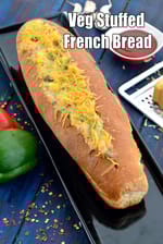 Veg Stuffed French Bread recipe | Cheesy Veggie Baguette Bake | Indian style Corn & Capsicum Cheese Bread |