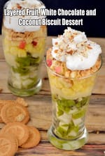 Layered Fruit, White Chocolate and Coconut Biscuit Dessert recipe | Coconut Biscuit Fruit Delight | Quick Indian Fruit Layered Eggless Dessert |