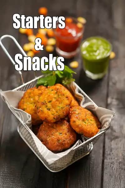 Indian vegetarian starters and snacks featuring crispy vegetable cutlets served with green chutney and tomato sauce