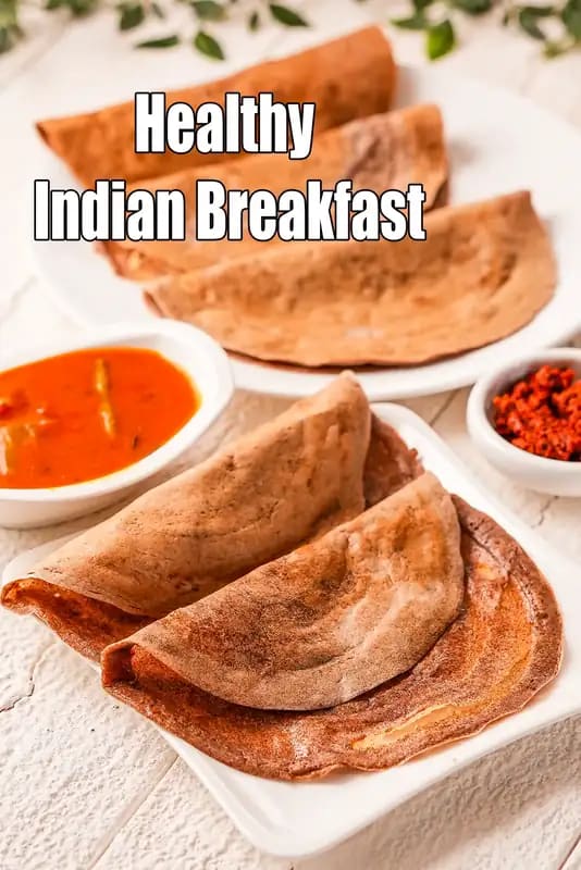 A high-angle shot of a healthy Indian breakfast featuring ragi (finger millet) dosas served with sambar and chutney, with the text Healthy Indian Breakfast overlaid.