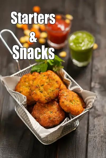 Indian vegetarian starters and snacks featuring crispy vegetable cutlets served with green chutney and tomato sauce