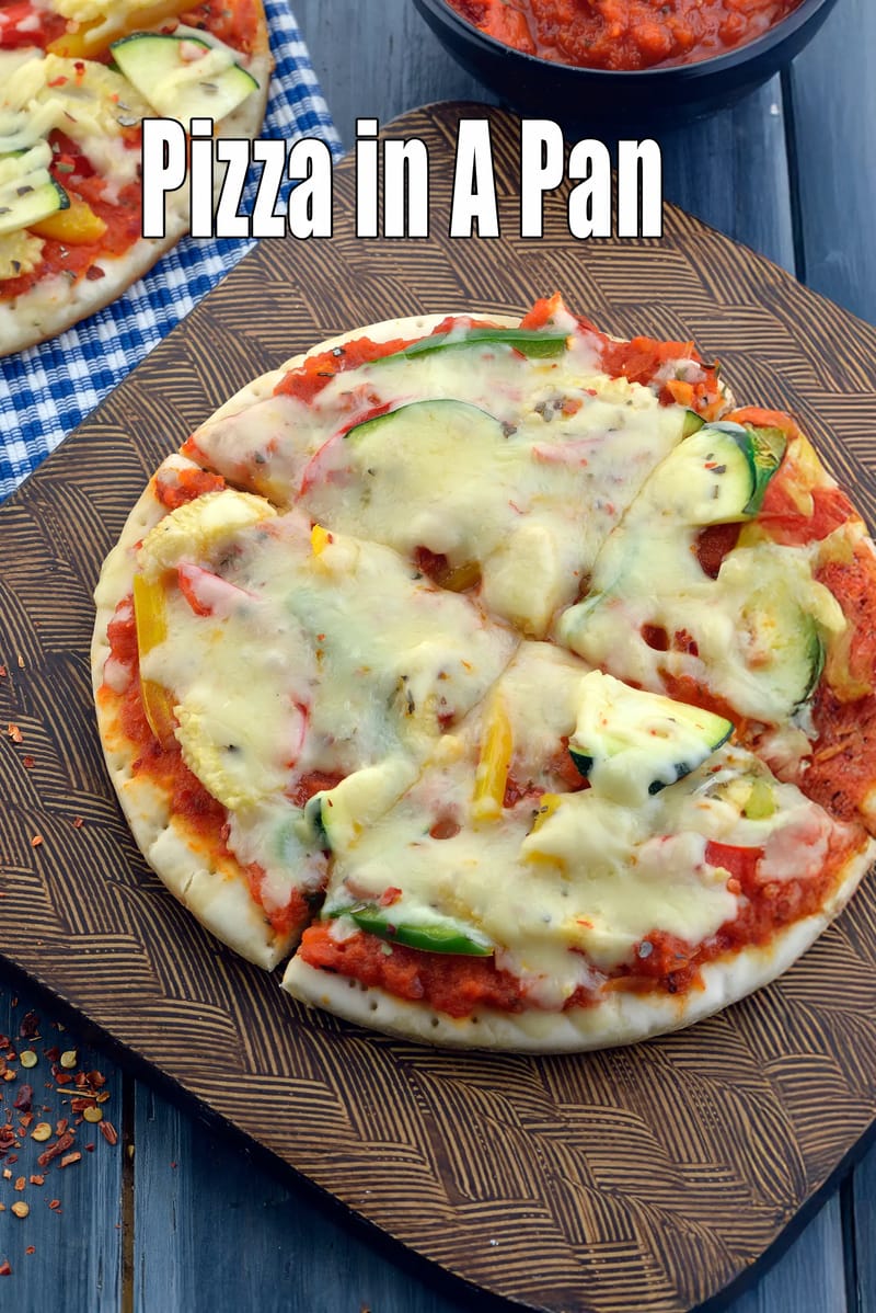 Pizza in a pan recipe | pan pizza | no oven Indian pizza | homemade pan pizza | pan pizza without oven | | Tarla Dalal