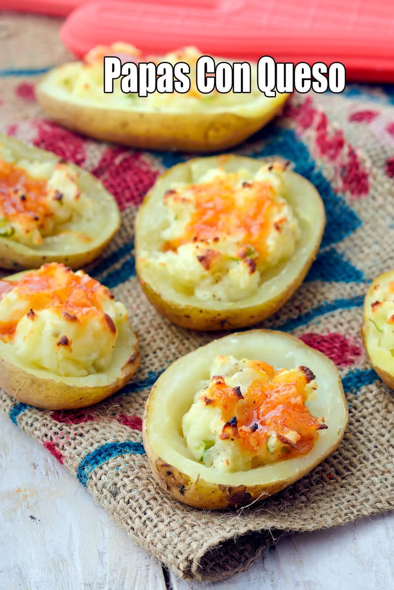 Mexican stuffed cheese potatoes | Indian style stuffed potatoes | cheese stuffed potato |  baked cheese potato halves | | Tarla Dalal