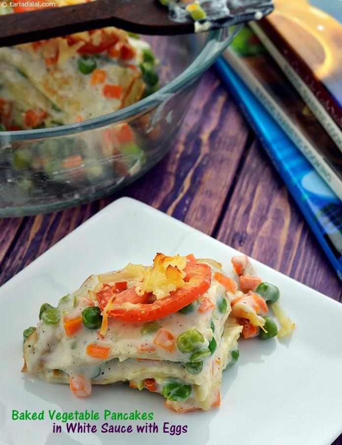Baked Vegetable Pancakes in White Sauce with Eggs
