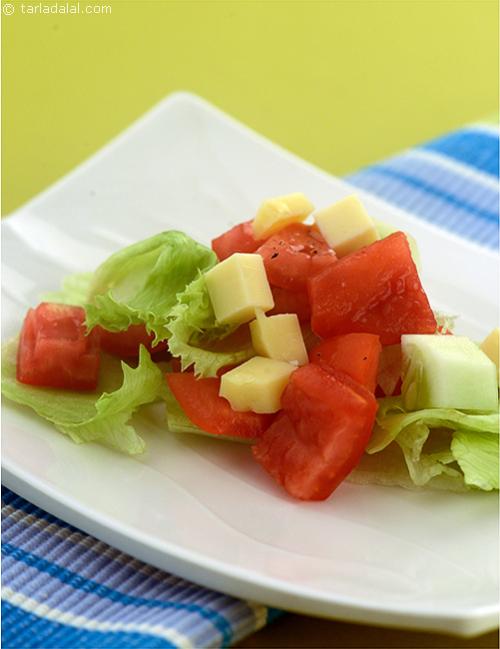 Tomato Cucumber and Lettuce Salad in A Lemon Dressing
