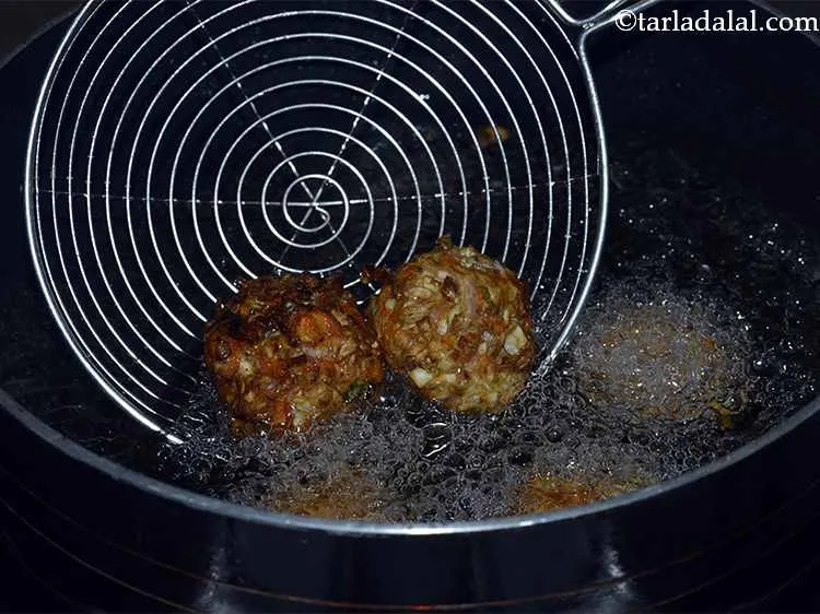 Step 13 – <p>Heat oil in a deep non-stick pan, enough to cover a few balls at a …
