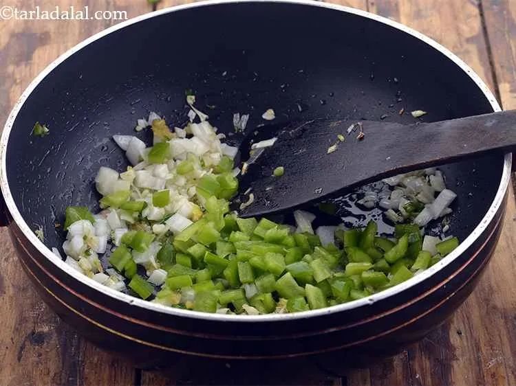 Step 20 – <p>With this, also add the capsicum. These are also not finely chopped.</p>