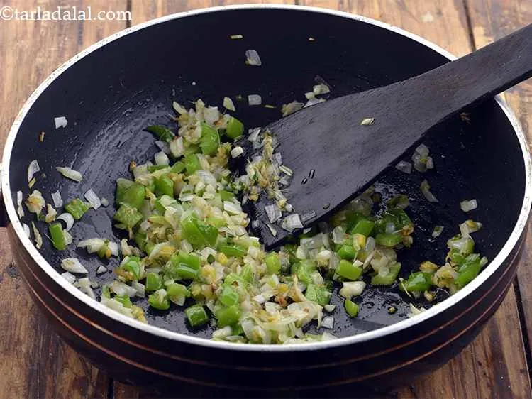 Step 21 – <p>Sauté these on a high flame for 1 minute only.</p>