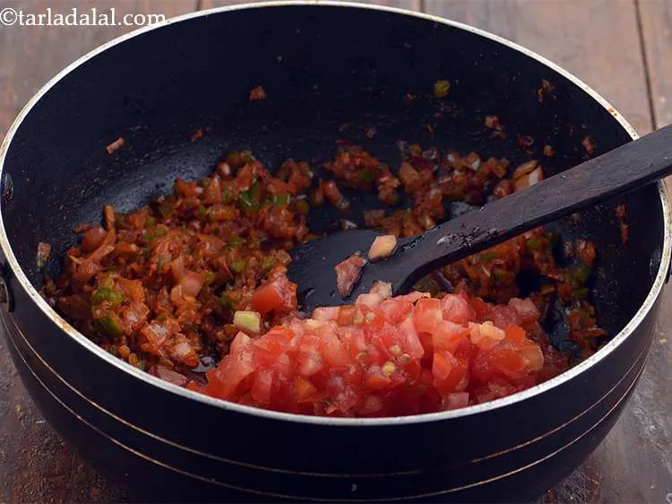 Step 12 – <p>Add the tomatoes into the pan.</p>