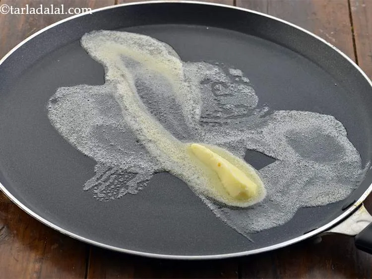 Step 25 – <p>Take a tava and heat it till it is hot enough. Put 1 tbsp of …