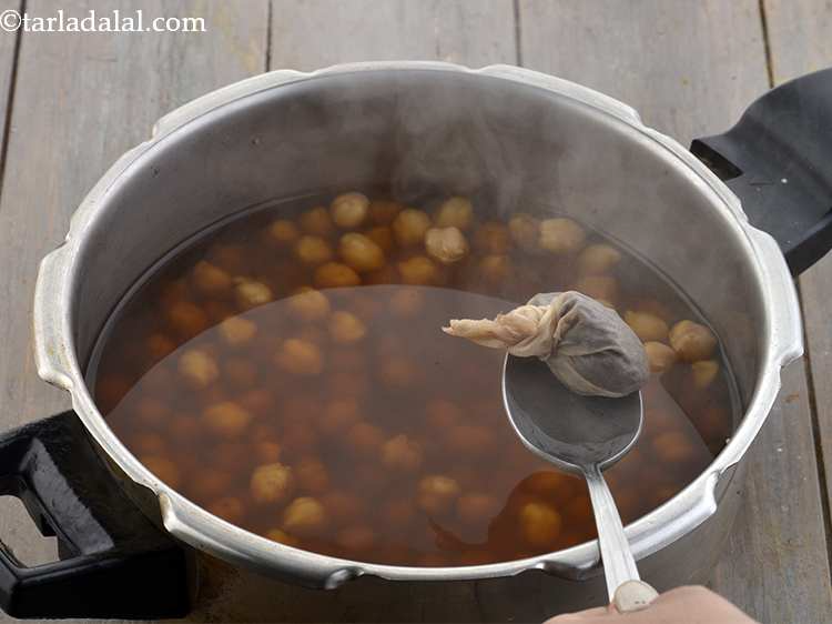 Step 12 – <p>Pressure cook it for 3 whistles. Allow the steam to escape before opening the lid. …