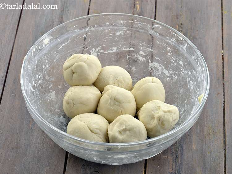 Step 38 – <p>Remove the muslin cloth. Divide the <strong>aloo bhatura</strong> dough into 8 equal portions.</p>