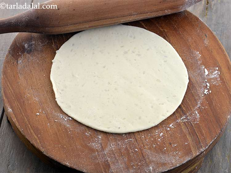 Step 39 – <p>Roll a portion of the dough into a 150 mm. (6”) diameter circle using a …