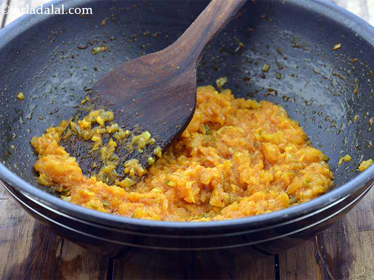 Step 18 – <p>Add the tomato pulp and sauté till the mixture leaves oil, while stirring continuously. When …