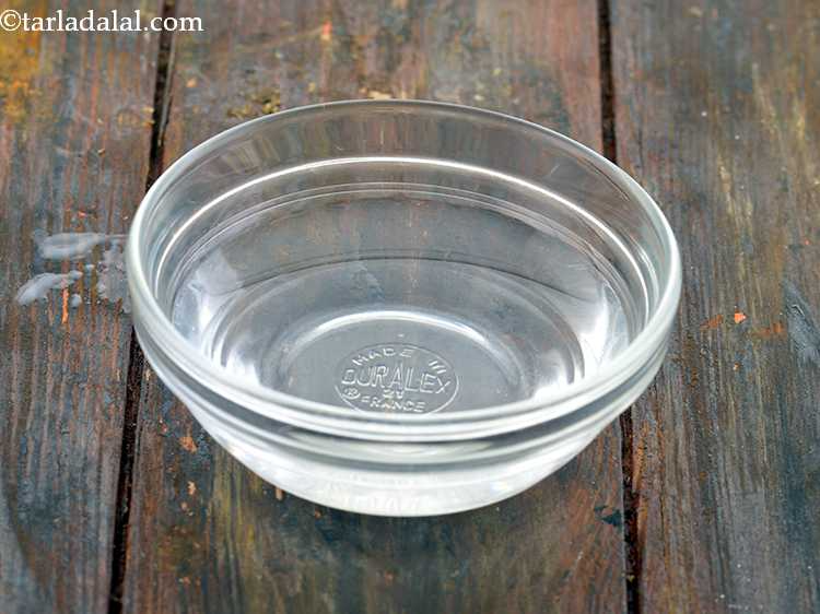 Step 15 – <p>To make&nbsp;<strong>Masala Water for</strong>&nbsp;<strong>Veg Frankie</strong>, take a small bowl and add the water into it.</p>