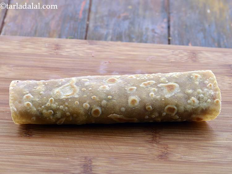 Step 29 – <p>Roll it up tightly to complete the<strong>&nbsp;Veg Frankie</strong>. Make sure that the stuffing doesn't fall …