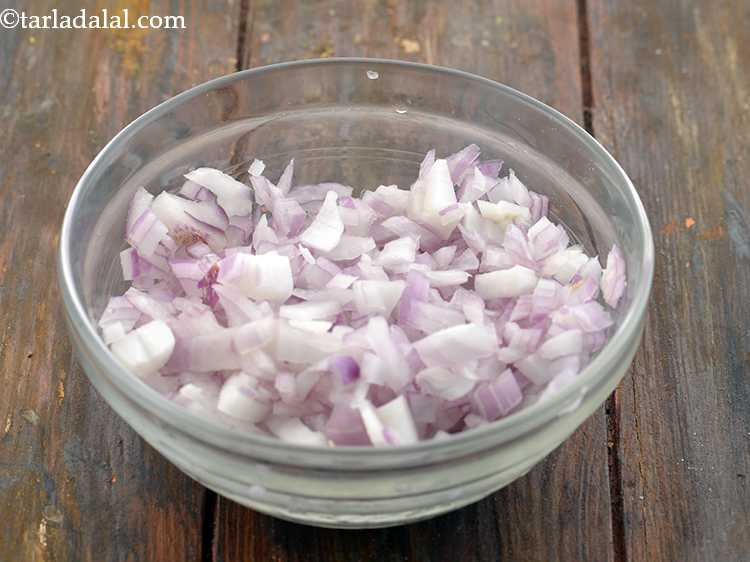 Step 10 – <p>To make the&nbsp;<strong>Onion Masala Mixture for&nbsp;Veg Frankie</strong>, take a bowl and add the chopped onions …