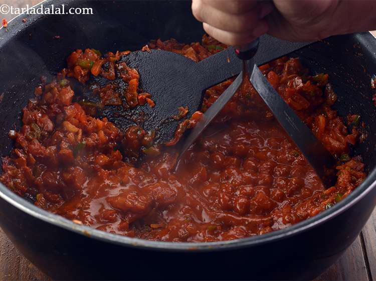 Step 18 – <p>Mash this mixture using a potato masher.You will get a mushy paste of the contents …