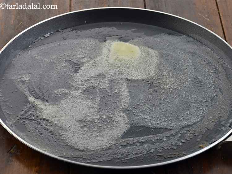 Step 29 – <p>Heat a large tava, add 2 tsp of butter.</p>