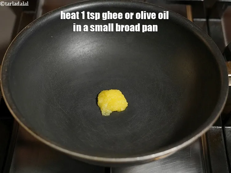 Step 20 – Heat&nbsp;1 tsp <a href="https://www.tarladalal.com/glossary-ghee-245i">ghee</a> or olive oil&nbsp;in a small broad pan.