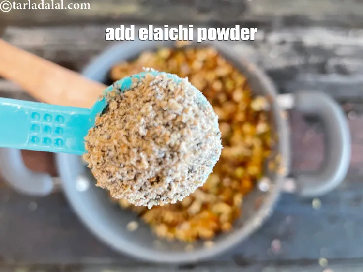 Step 22 – <span style="font-family:Arial,sans-serif">Add 1/4 tsp&nbsp;<a href="https://www.tarladalal.com/glossary-cardamom-powder-elaichi-powder-265i"><span style="color:blue">cardamom (elaichi) powder</span></a>.</span>