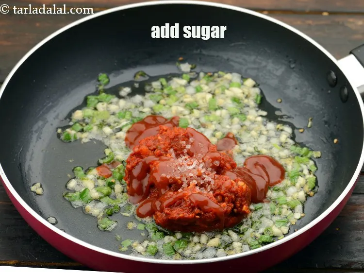 Step 31 – Add&nbsp;a pinch of&nbsp;<a href="https://www.tarladalal.com/glossary-sugar-chini-shakkar-278i">sugar</a>.