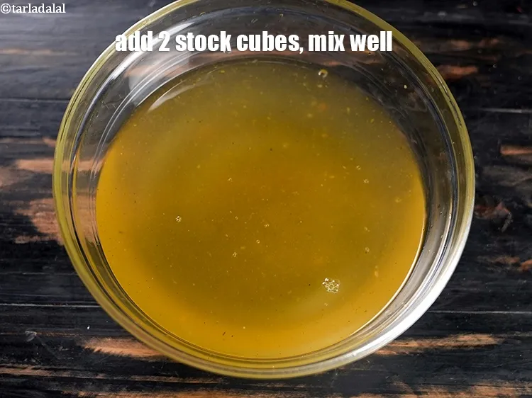 Step 4 – Add 2 <a href="https://www.tarladalal.com/glossary-bouillon-cubes-1572i">stock cubes</a>, mix well and keep aside.