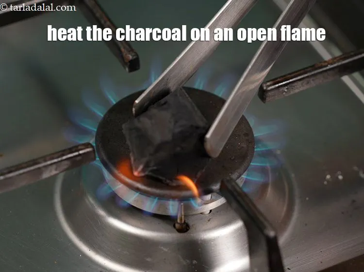 Step 29 – Meanwhile heat the charcoal on an open flame till well burnt.&nbsp;