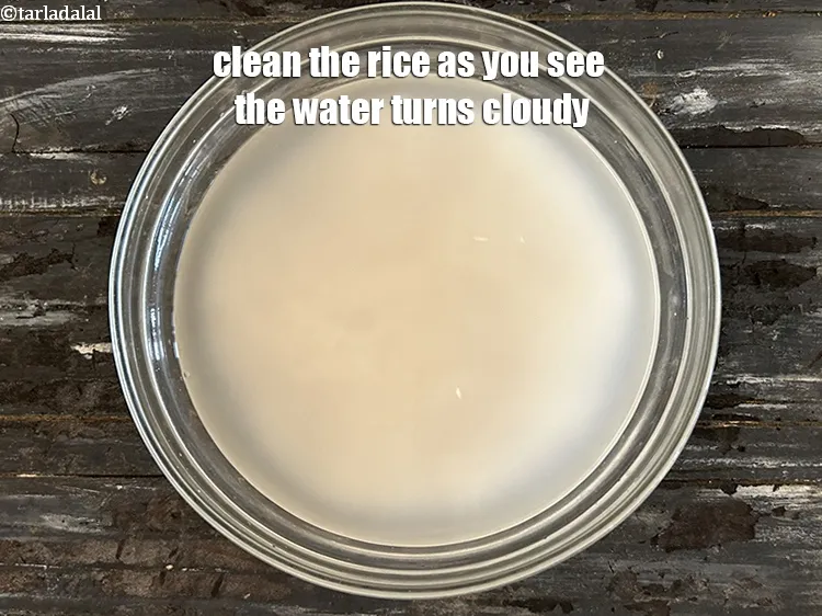 Step 37 – Clean the rice as you can see the water looks cloudy.