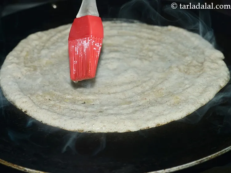 Step 29 – Smear &frac14; tsp of oil over it and along the edges.