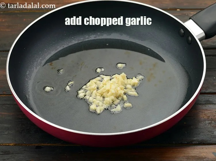 Step 23 – Add 1 tbsp&nbsp;<a href="https://www.tarladalal.com/glossary-chopped-garlic-790i">chopped garlic (lehsun)</a>.