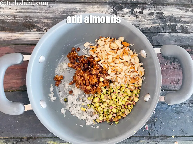 Step 15 – Add&nbsp;<meta charset="UTF-8" />1/3 cup&nbsp;<a href="glossary-chopped-almonds-865i">chopped almonds (badam)</a>.