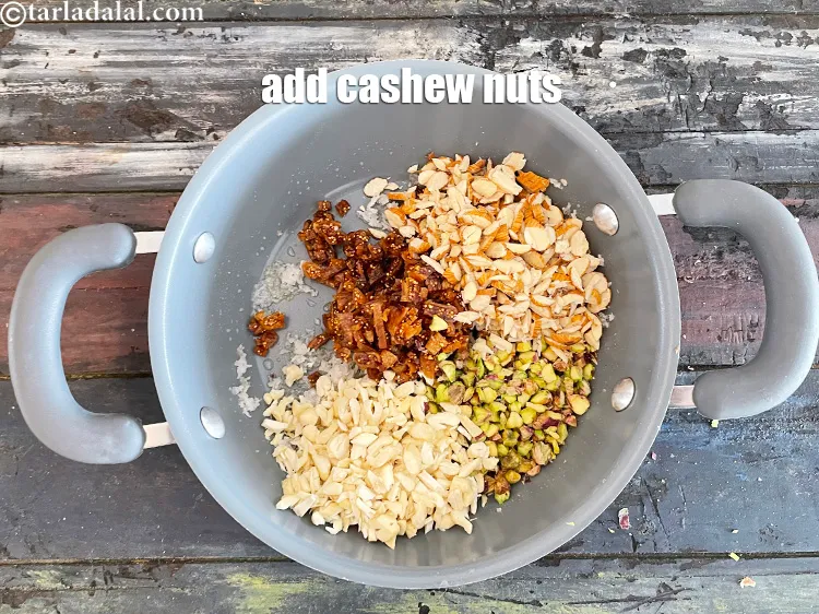 Step 16 – Add&nbsp;<meta charset="UTF-8" />1/3 cup&nbsp;<a href="glossary-chopped-cashew-nut-791i">chopped cashew nut (kaju)</a>.