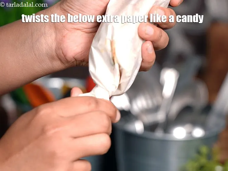 Step 60 – Twists the below extra paper like a candy.