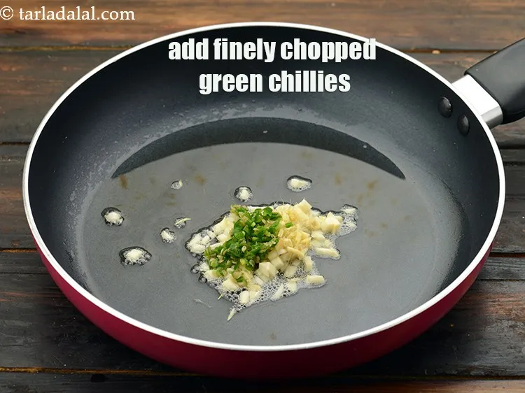 Step 25 – Add 1 tsp&nbsp;finely&nbsp;<a href="https://www.tarladalal.com/glossary-chopped-green-chilli-820i">chopped green chillies</a>.&nbsp;