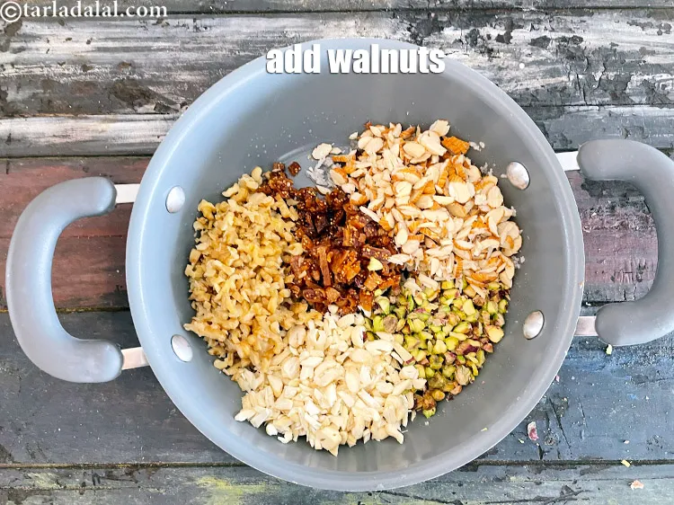 Step 17 – Add&nbsp;<meta charset="UTF-8" />1/3 cup&nbsp;<a href="glossary-chopped-walnuts-785i">chopped walnuts (akhrot)</a>.