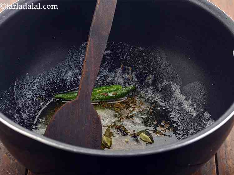 Step 16 – <p>And finally cardamoms. These condiments will further help to enhance the flavour of the dal …