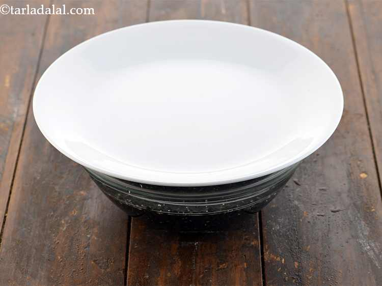 Step 3 – <p>Cover and keep the whole urad bowl aside for overnight. It is important to soak …