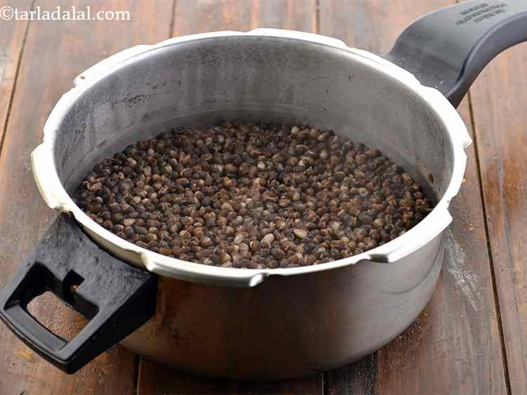 Step 9 – <p>Pressure cook for 7 whistles or till the dals are overcooked. Both the urad dal …