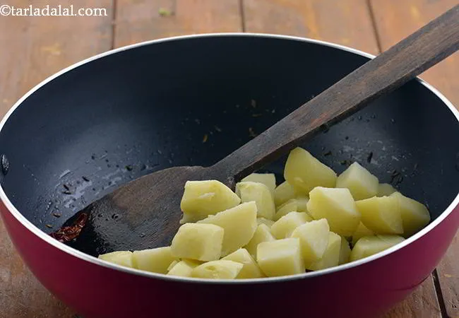 Step 10 – Also add the boiled potato cubes to the <strong>Aloo Methi</strong> subzi.