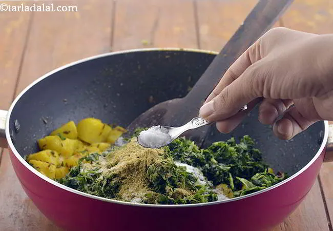 Step 14 – Finally add the salt to the&nbsp;<strong>Aloo Methi</strong>.&nbsp;