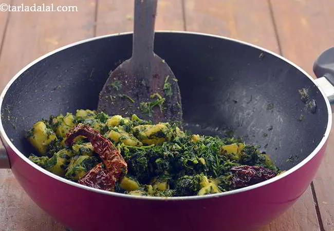 Step 15 – Mix well and cook&nbsp;<b><span style="font-size: 12pt; font-family: Cambria;">| Punjabi aloo methi&nbsp;</span></b>&nbsp;on a medium flame for …