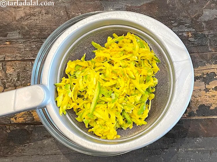 Step 12 – <meta charset="UTF-8" /> Place the marinated raw mango in a sieve over a glass bowl. …