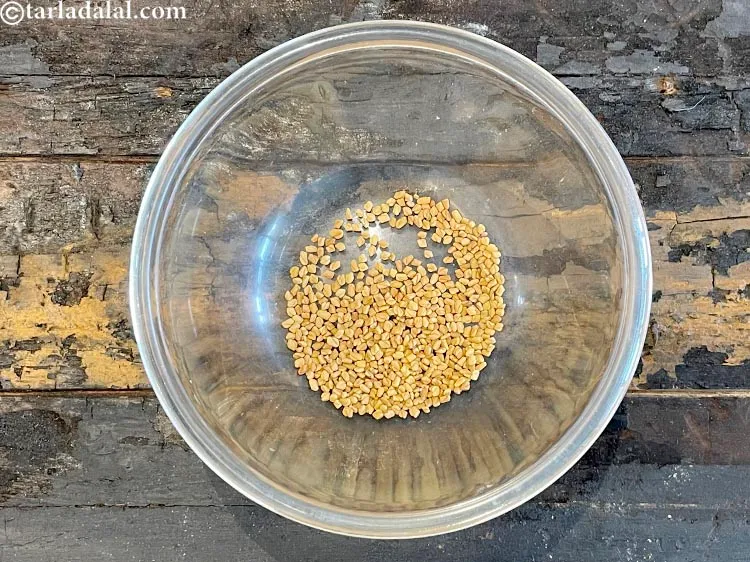Step 15 – In a deep glass bowl put&nbsp;<meta charset="UTF-8" />1 tbsp&nbsp;<a href="glossary-fenugreek-seeds-methi-dana-methi-ke-dane-methi-seeds-991i">fenugreek (methi) seeds</a>.