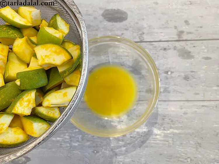 Step 15 – See the water which is released from the mangoes. Discard the water.