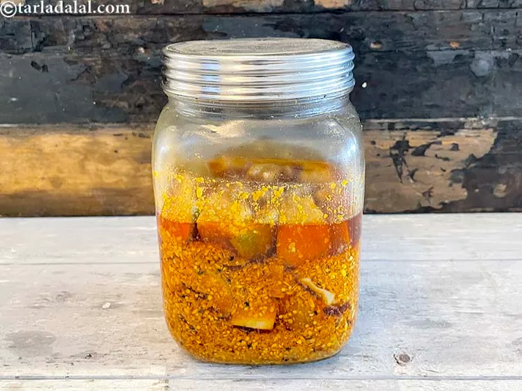 Step 37 – During storage, once in a while, take a spoon and mix the pickle in the …