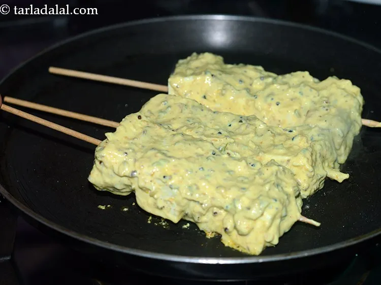 Step 19 – Place a few satays on it and cook on a medium flame. Do not overcook …