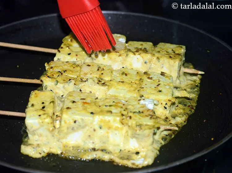 Step 20 – Drizzle a little oil and cook till they turn golden brown in colour from all …