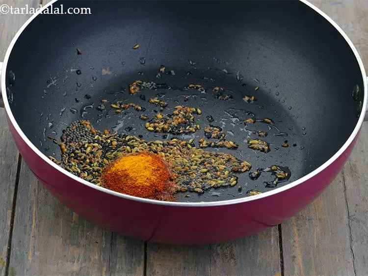 Step 9 – Add the chilli powder. This gives a nice spice and colour to the recipe.&nbsp;