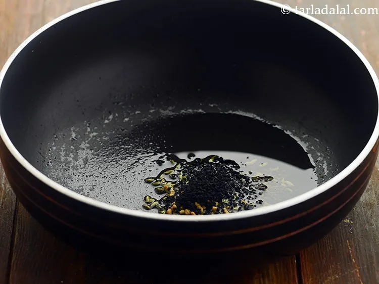 स्टेप 5 – कलौंजी डालें।